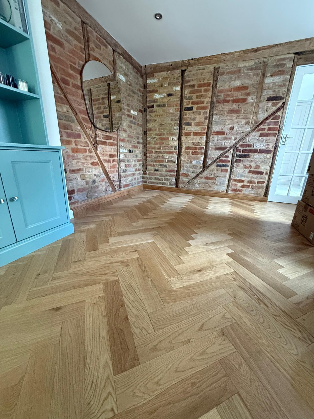 Almond narrow herringbone oak laid through a period family home.